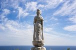 Buddhist statue overlooking the Pacific Ocean on Umakorobi zaka slope, Ohechi route. Ohechi route.