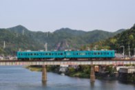 Small train crossing a bridge over the Kozagawa river, Ohechi route